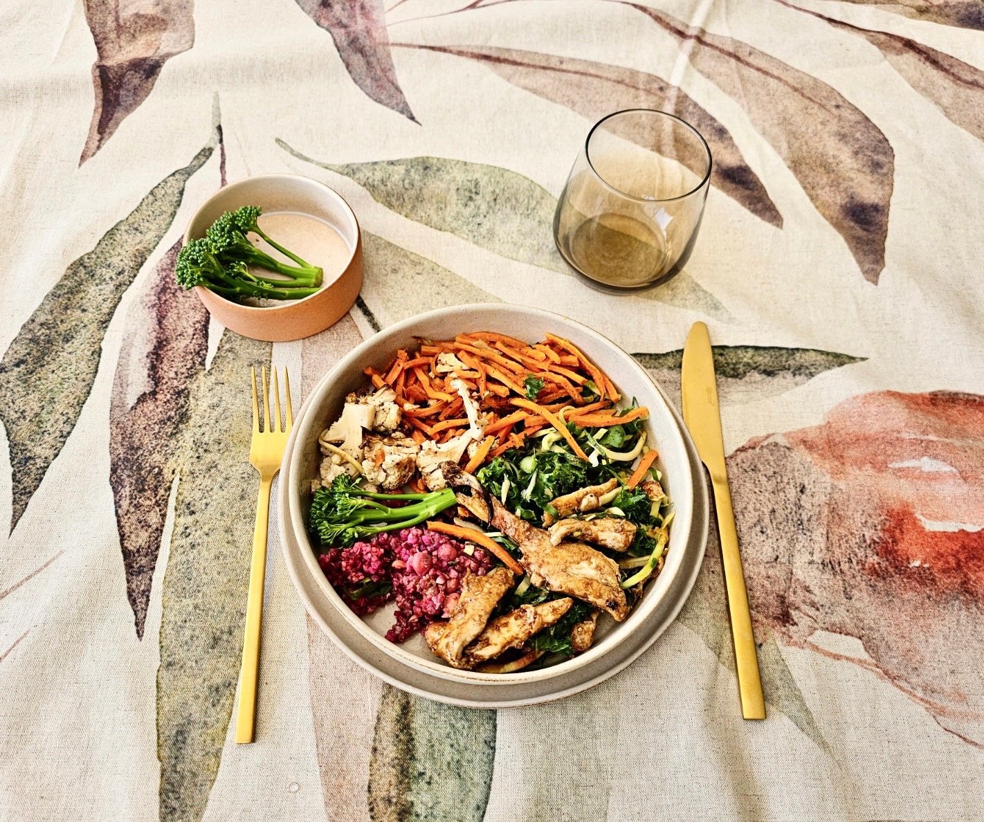 Cooked Food on White Crockery With golden utensils on Designer Tablecloth