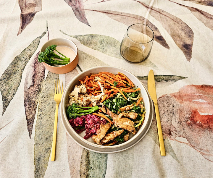 Cooked Food on White Crockery With golden utensils on Designer Tablecloth